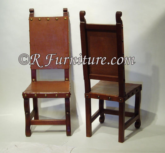 Spanish Colonial style leather side chairs with a chestnut finish, upholstered in brown leather. Spanish style furniture