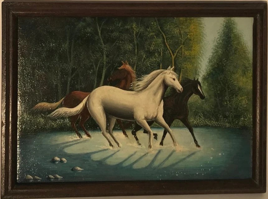 A painting of three horses running through a river, with a forest backdrop and a blue sky, hand-painted on a wooden panel.