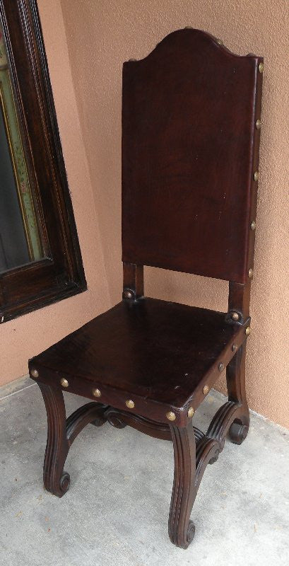 handmade leather Valencia side chair - Spanish style brown wooden chair with leather seat and intricate woodcarvings on the legs.